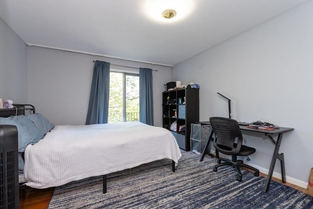 57 Saint Paul St Unit 19, Brookline, MA 02445 - bedroom with wood finished floors, a desk, and baseboards