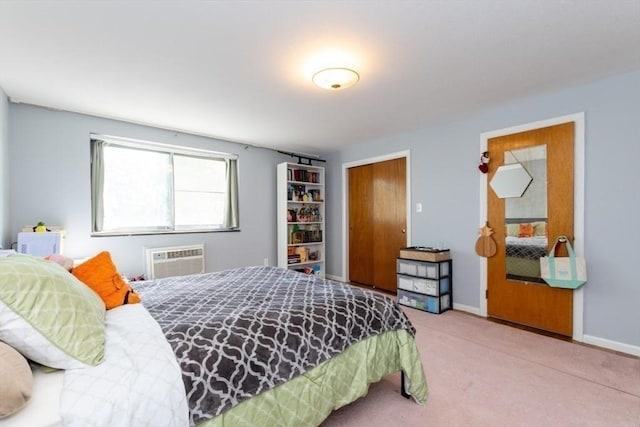 57 Saint Paul St Unit 19, Brookline, MA 02445 - carpeted bedroom featuring an AC wall unit and baseboards