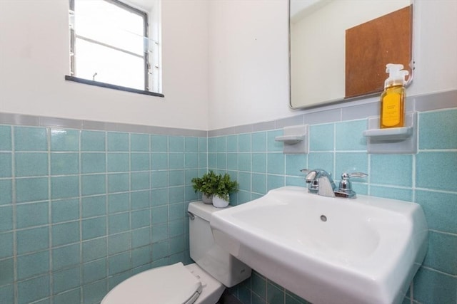 57 Saint Paul St Unit 19, Brookline, MA 02445 - bathroom with a sink, toilet, tile walls, and a wainscoted wall