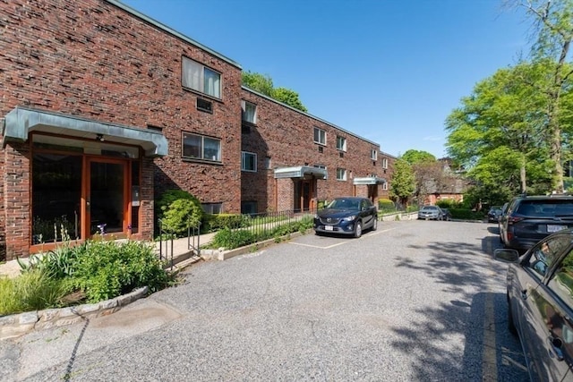 57 Saint Paul St Unit 19, Brookline, MA 02445 - view of asphalt road featuring curbs