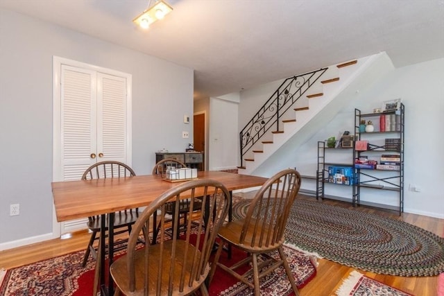 57 Saint Paul St Unit 19, Brookline, MA 02445 - dining room featuring wood finished floors and stairway