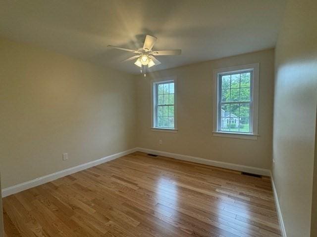 70 Kilburn St, Lunenburg, MA 01462 - unfurnished room featuring baseboards, wood finished floors, and a ceiling fan