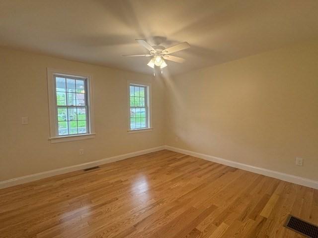 70 Kilburn St, Lunenburg, MA 01462 - unfurnished room featuring baseboards, light wood-style floors, and ceiling fan