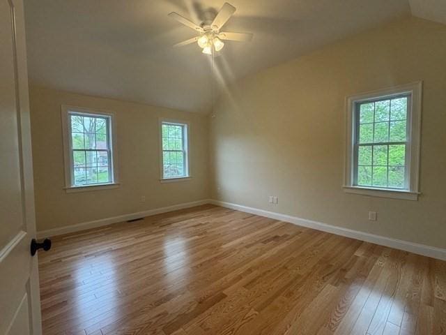 70 Kilburn St, Lunenburg, MA 01462 - empty room featuring lofted ceiling, light wood-type flooring, a ceiling fan, and baseboards