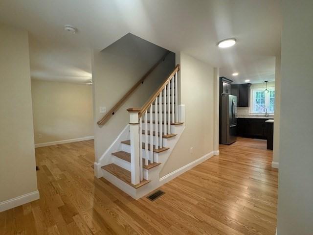 70 Kilburn St, Lunenburg, MA 01462 - stairs featuring wood finished floors and baseboards