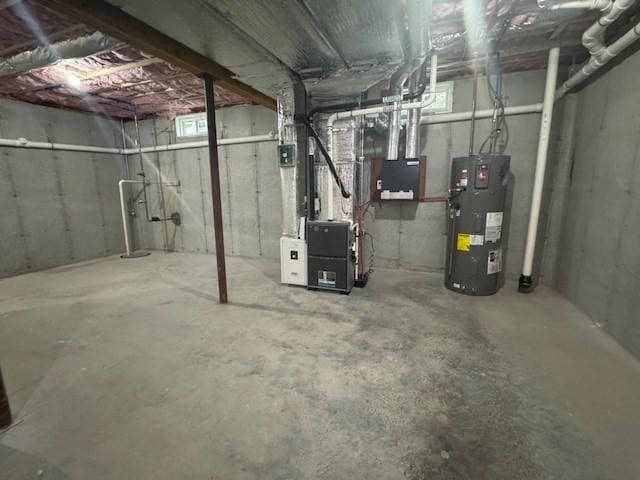 70 Kilburn St, Lunenburg, MA 01462 - unfinished below grade area with electric water heater and heating unit