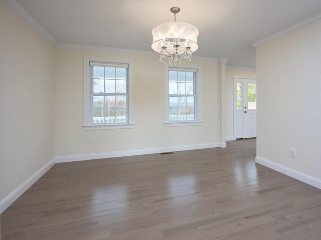 70 Kilburn St, Lunenburg, MA 01462 - spare room featuring a chandelier, wood finished floors, crown molding, and baseboards