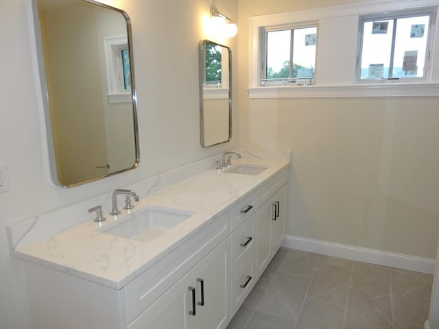 bathroom with tile patterned flooring and vanity