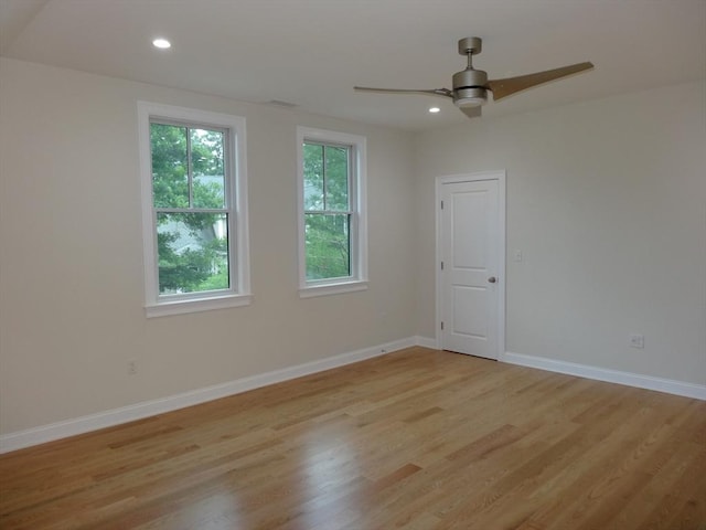 unfurnished room with ceiling fan and light hardwood / wood-style flooring