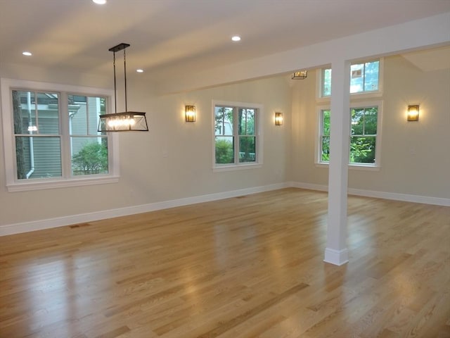 unfurnished living room with light hardwood / wood-style flooring