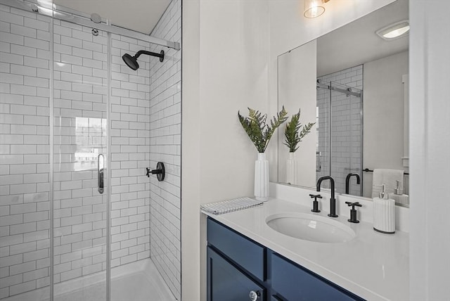 bathroom with vanity and an enclosed shower