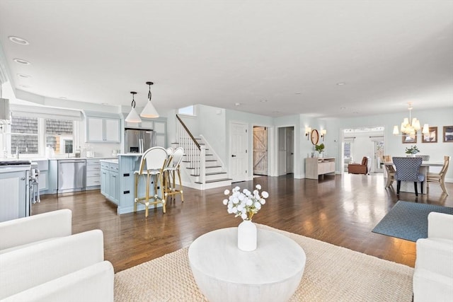77 Lighthouse Rd, Scituate, MA 02066 - living area with stairs, a chandelier, wood finished floors, healthy amount of natural light, and recessed lighting