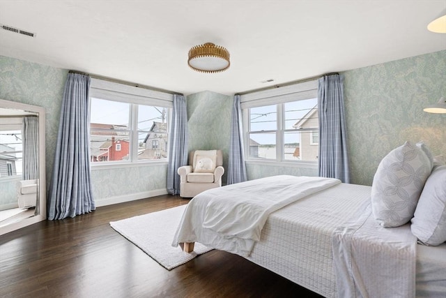 77 Lighthouse Rd, Scituate, MA 02066 - bedroom featuring wallpapered walls, wood finished floors, and baseboards
