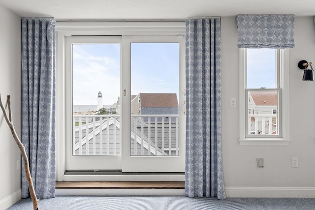 77 Lighthouse Rd, Scituate, MA 02066 - doorway to outside featuring baseboards, healthy amount of natural light, and carpet floors