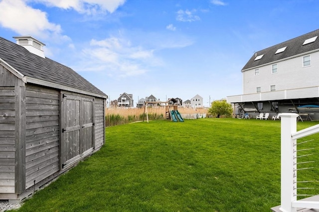 77 Lighthouse Rd, Scituate, MA 02066 - view of green lawn featuring a playground and a residential view