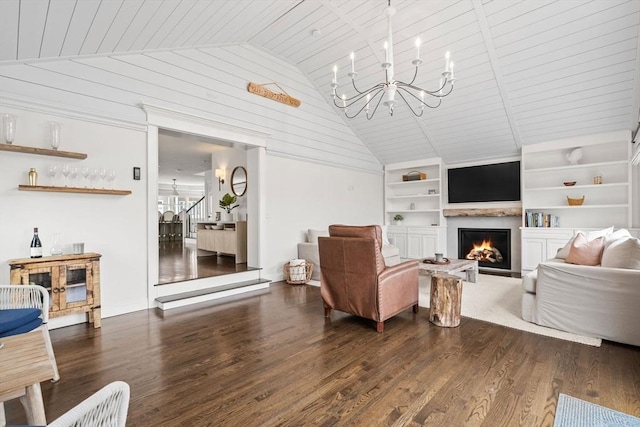 77 Lighthouse Rd, Scituate, MA 02066 - living room featuring dark wood finished floors, built in features, a chandelier, a lit fireplace, and wooden ceiling