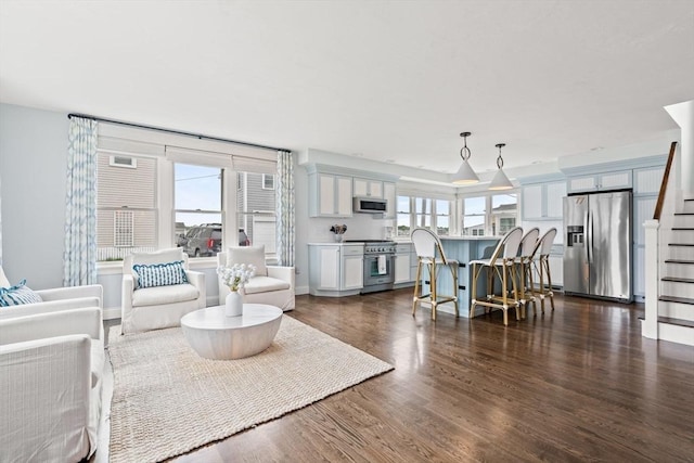 77 Lighthouse Rd, Scituate, MA 02066 - living room featuring dark wood-style floors, stairs, and plenty of natural light