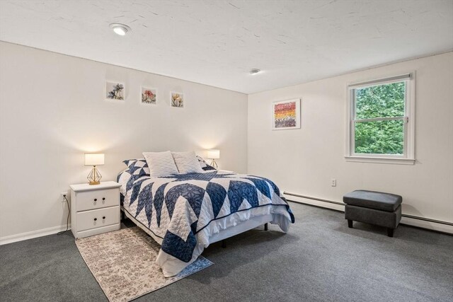 carpeted bedroom featuring baseboards and baseboard heating