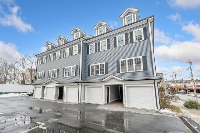 townhome / multi-family property featuring a garage