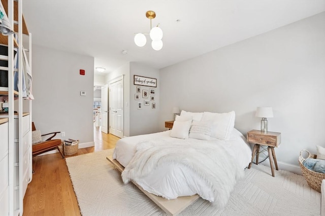 bedroom featuring light hardwood / wood-style floors and a closet