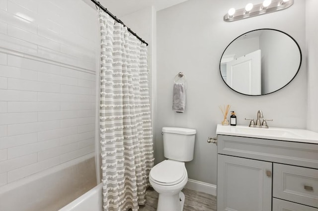 full bathroom featuring vanity, shower / tub combo, and toilet