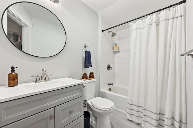 full bathroom with vanity, toilet, and shower / bath combo with shower curtain