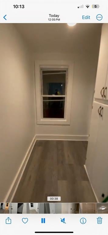 hallway with dark hardwood / wood-style floors