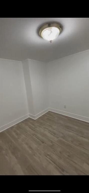 empty room featuring dark wood-type flooring