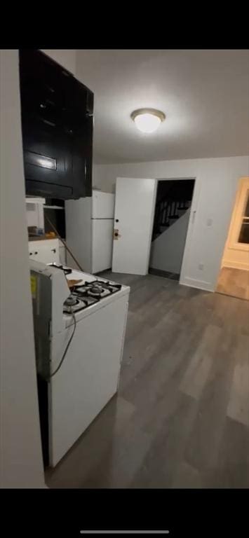 kitchen with white cabinets and white appliances