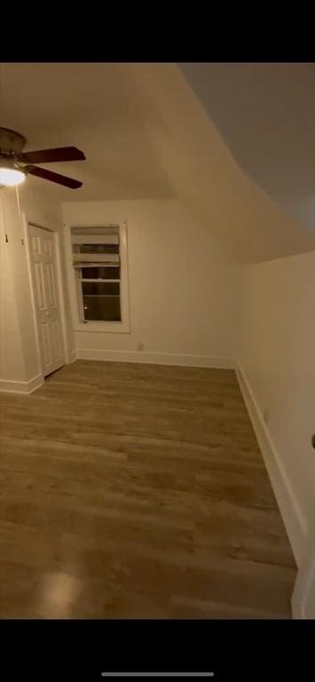 bonus room with ceiling fan, wood-type flooring, and lofted ceiling