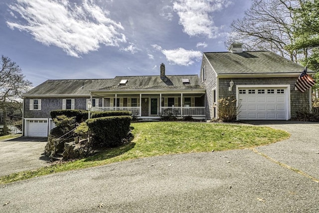 31 Baxendale Rd, Bourne, MA 02532 - view of front facade featuring a porch, a garage, a chimney, a front lawn, and driveway