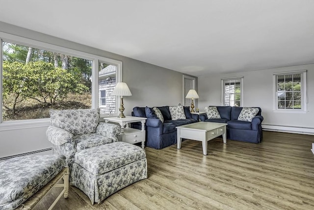 31 Baxendale Rd, Bourne, MA 02532 - living area with baseboard heating, a baseboard radiator, and wood finished floors