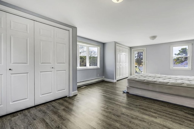 31 Baxendale Rd, Bourne, MA 02532 - bedroom with dark wood-type flooring, access to exterior, a baseboard heating unit, and baseboards
