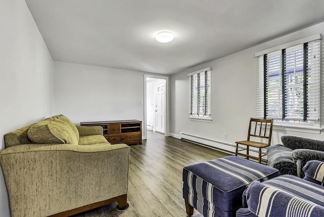 31 Baxendale Rd, Bourne, MA 02532 - living room featuring a baseboard radiator, wood finished floors, and baseboards