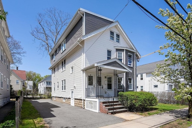 american foursquare style home featuring a residential view