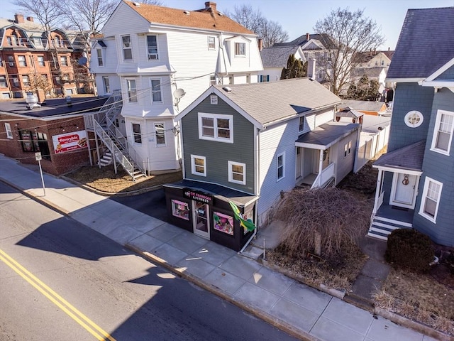 view of front of house with driveway and a residential view