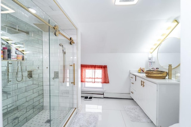 bathroom with lofted ceiling, baseboard heating, a shower stall, and vanity