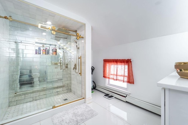 full bath featuring a shower stall, a baseboard heating unit, and tile patterned floors