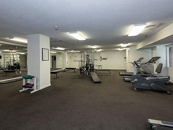 workout area featuring a textured ceiling