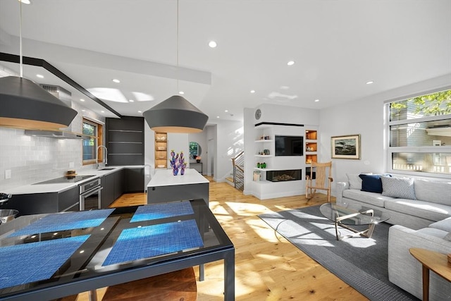 137 Walden St Unit 137, Cambridge, MA 02140 - living area featuring recessed lighting, light wood-style floors, and stairs