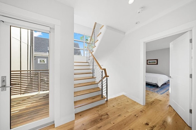 137 Walden St Unit 137, Cambridge, MA 02140 - stairs featuring wood-type flooring and baseboards