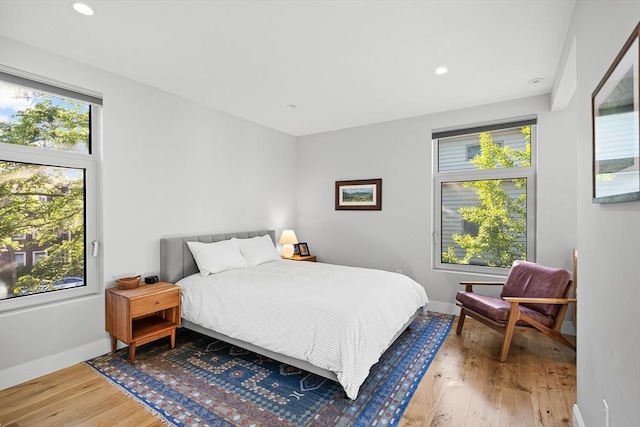 137 Walden St Unit 137, Cambridge, MA 02140 - bedroom featuring wood finished floors, baseboards, and recessed lighting