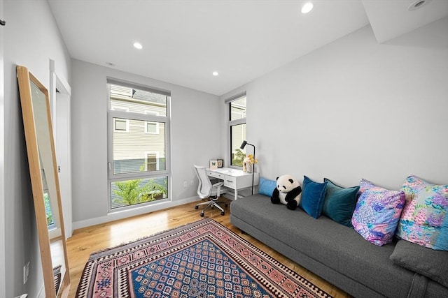 137 Walden St Unit 137, Cambridge, MA 02140 - living room with wood finished floors, recessed lighting, an office area, and baseboards