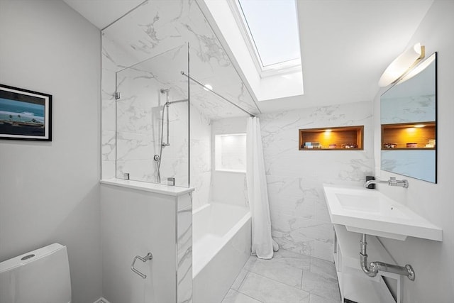 137 Walden St Unit 137, Cambridge, MA 02140 - bathroom featuring a skylight, shower / bath combination with curtain, marble finish floors, toilet, and a sink