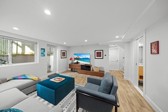 137 Walden St Unit 137, Cambridge, MA 02140 - living room with light wood-style floors, recessed lighting, and baseboards
