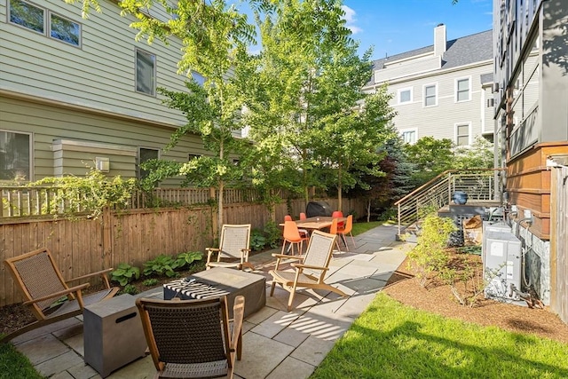 137 Walden St Unit 137, Cambridge, MA 02140 - view of patio featuring an outdoor fire pit