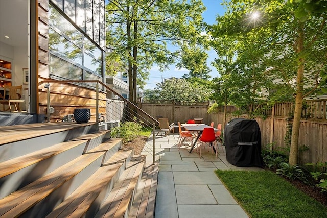 137 Walden St Unit 137, Cambridge, MA 02140 - view of patio / terrace with stairs, outdoor dining space, and a grill
