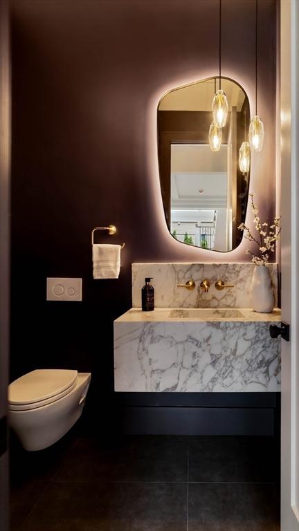 95 Blake St, Newton, MA 02460 - half bath featuring tile patterned floors, vanity, and toilet