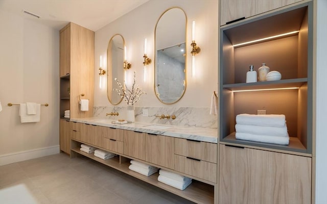 95 Blake St, Newton, MA 02460 - full bathroom featuring double vanity, baseboards, and tile patterned flooring