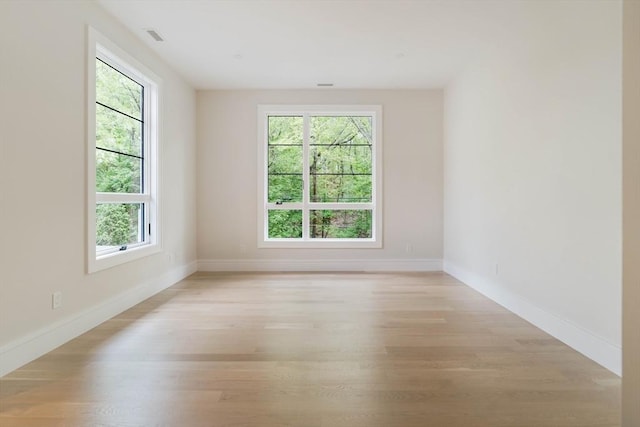 95 Blake St, Newton, MA 02460 - empty room with light wood-style floors and baseboards